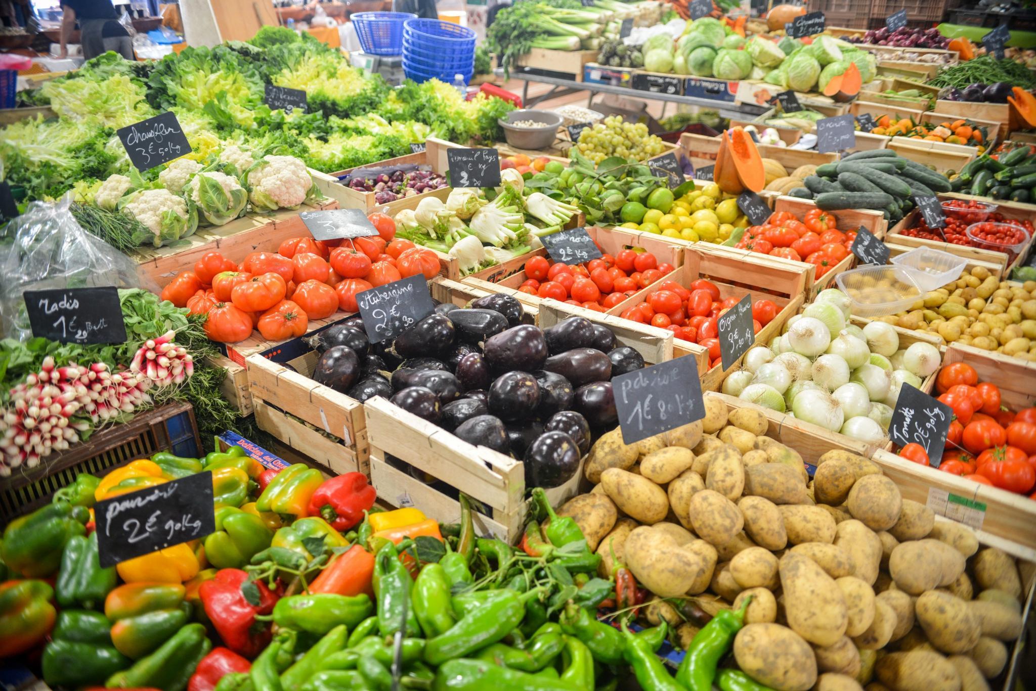 Various vegetables on a market place, organic or GMO?